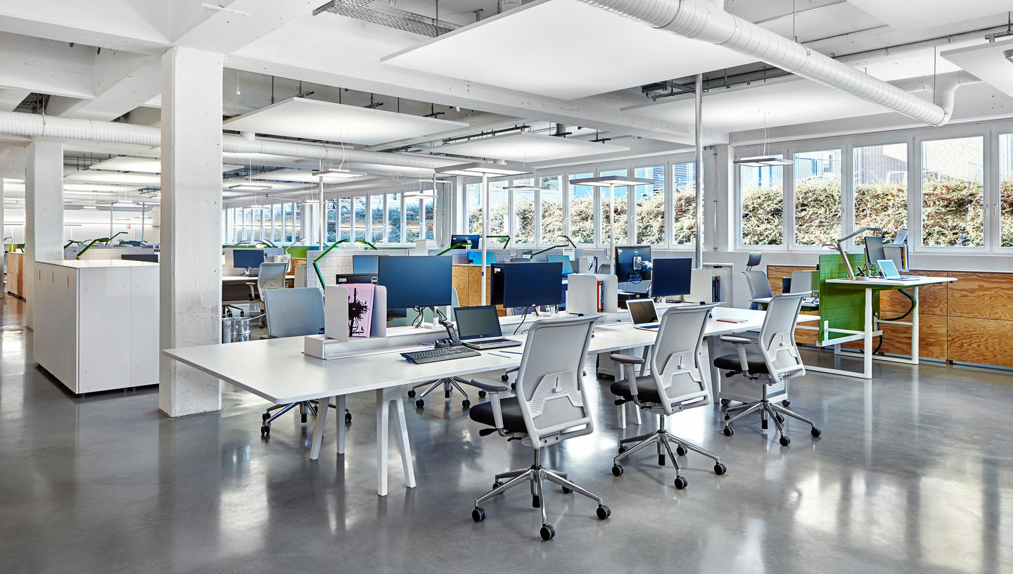 Bright office with desks and workstations